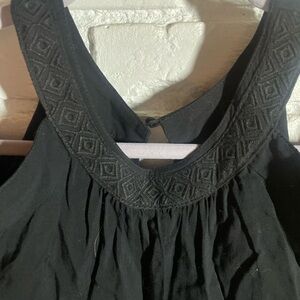 Elegant Black Top with Textured Neckline